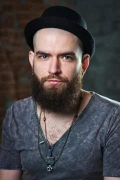Portrait of a bearded guy in a hat. Cute bald guy with a beard Stock Photos
