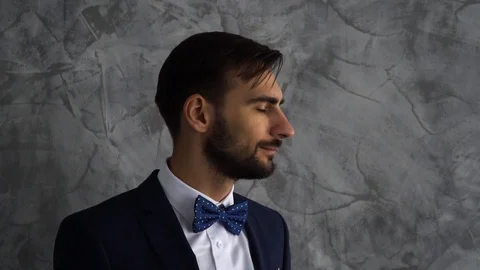 Portrait of bearded man in dark blue suit look in camera and smile. Stock Footage 113003138