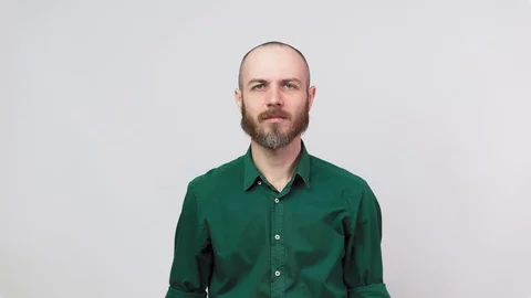 Portrait of bearded man having headache isolated over white background. Stock Footage 126762867