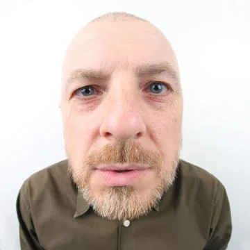 Portrait of a bearded man on a light background Stock Photos