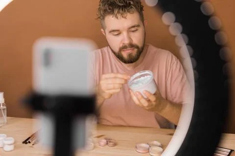  Portrait bearded man making vlog review cosmetics product and channel rec... Stock Photos