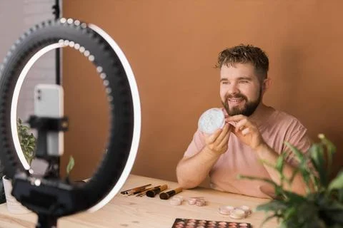  Portrait bearded man making vlog review cosmetics product and channel rec... Stock Photos