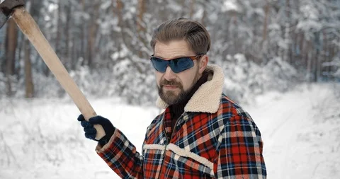 Portrait of bearded man posing on camera at snowy forest Stock Footage 125160237