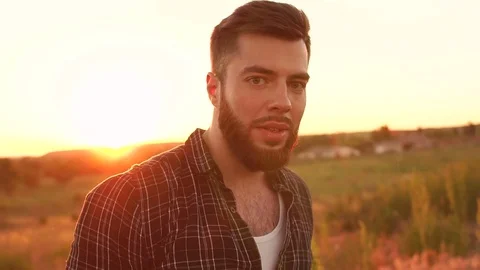 Portrait of bearded man on sunset background. Stock Footage 76638106