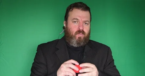 Portrait of bearded security man with red nose in front of green screen Vídeo Stock 122282023