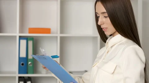Portrait of a beautiful 25 year old Caucasian looking girl with a sincere smile Stock Footage 132407640