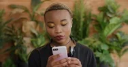 Portrait Of Beautiful African American Woman Student Using Smartphone Enjoying Stock Footage