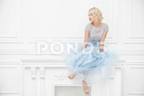 A portrait of a beautiful blonde lady. Bright pure colors. Fashion, beauty. Stock Photos