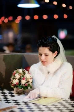 Portrait of the beautiful bride in cafe Stock Photos
