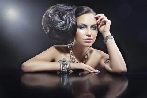 Portrait of beautiful brunette woman wearing jewellery Stock Photos