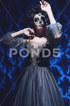 Portrait of a beautiful Calavera Catrina. Fashion model with sugar skull make Stock Photos
