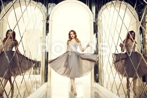 A portrait of a beautiful elegant woman in the evening dress. Fashion, evenin Stock Photos