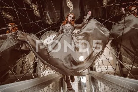 A portrait of a beautiful elegant woman in the fluttering wedding dress. Fash Stock Photos