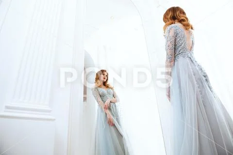 A portrait of a beautiful elegant woman in the wedding dress. Fashion, weddin Stock Photos