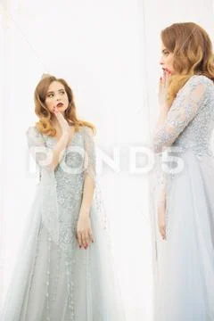 A portrait of a beautiful elegant woman in the wedding dress. Fashion, weddin Stock Photos