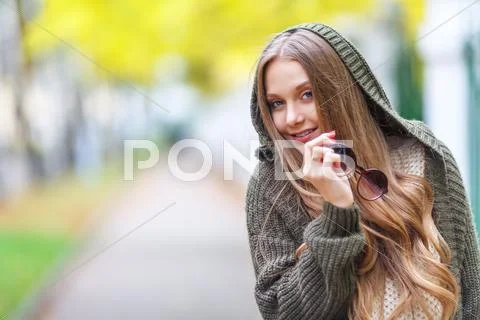 Portrait of a beautiful female model in autmn clothes outdoor. sensetive look Stock Photos