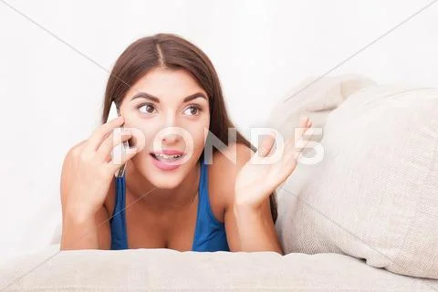 Portrait of beautiful girl talking by phone Stock Photos