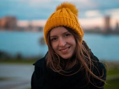 Portrait of a beautiful girl in a yellow hat Stock Photos