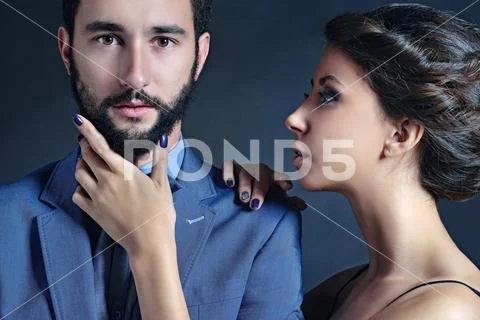 Portrait of beautiful lady with handsome guy in suit Stock Photos