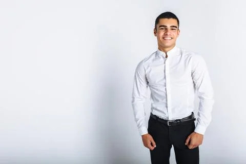 Portrait of a beautiful man posing in the Studio. White background, isolated. Stock Photos