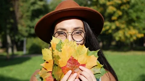 Portrait of a beautiful middle eastern smiling woman holding a bouquet of Stock Footage 143856211