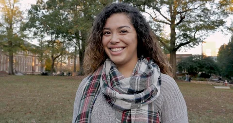 Portrait of a beautiful multi ethnic mixed race woman college student on campus Stock Footage 104499665