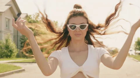 Portrait of beautiful smiling model dressed in summer hipster jeans shorts Stock Footage 142347433