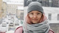 Portrait Of Beautiful Smiling Young Woman Outside Enjoying Winter Snowfall Stock Footage