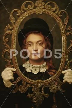 Portrait of a beautiful Victorian woman in an old vintage frame. Steampunk. Stock Photos