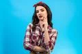 The portrait of the beautiful woman on the blue background Photo