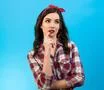 The portrait of the beautiful woman on the blue background Photo
