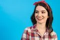 The portrait of the beautiful woman on the blue background Photo