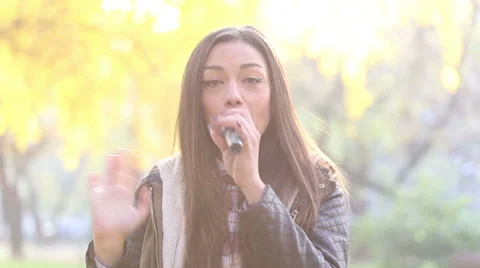 Portrait of beautiful woman singing with microphone Stock Footage 59556598