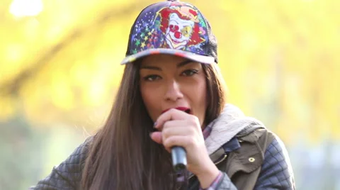 Portrait of beautiful woman singing into microphone and dancing Stock Footage 59556672