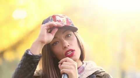 Portrait of beautiful woman singing into microphone and dancing Stock Footage 59556678