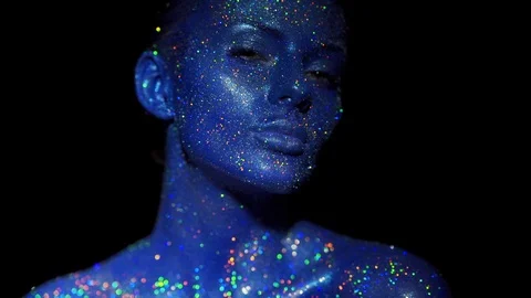 Portrait of beautiful woman with sparkles on her face Stock Footage