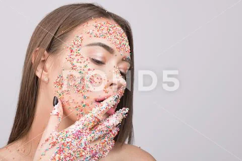 Portrait of beautiful woman with sparkles. Stock Photos