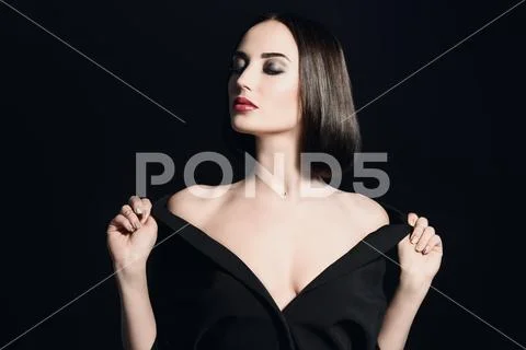 A portrait of a beautiful woman wearing a black blazer. Fashion, style. Stock Photos