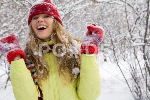 Portrait of beautiful woman in winter clothing having fun outdoor Stock Photos