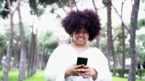 Portrait beautiful young african american woman using smartphone taking sel.. Stock Footage 264616632