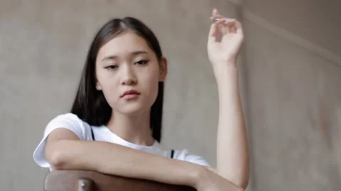 Portrait of a beautiful young Asian model looking at the camera. 스톡 동영상 203970962