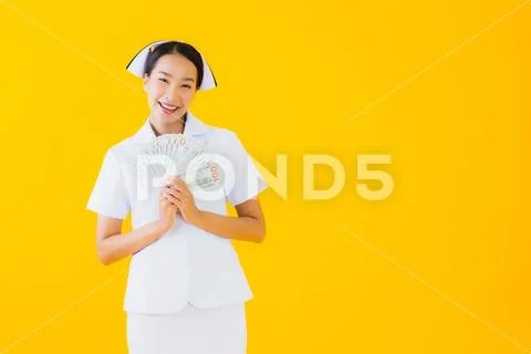 Portrait beautiful young asian woman thai nurse with a lot of cash and money Stock-Fotos