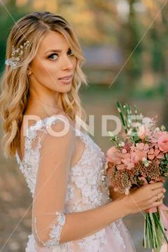 Portrait of a beautiful young bride on the background of nature Stock Photos