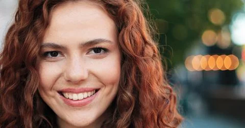 Portrait of beautiful young girl of caucasian ethnicity with curly ginger hair Stock Photos