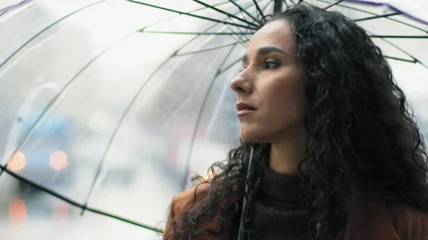 Portrait of beautiful young girl pensive serious woman stands in city with Stock Footage 165777046