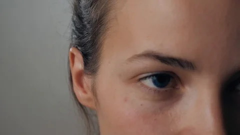 Portrait of a beautiful young, in a leather jacket with airpods in her ear Stock Footage 97694863