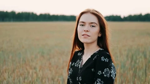 Portrait of beautiful young red haired woman looking up to the camera. Carefree Stock Footage 139329476
