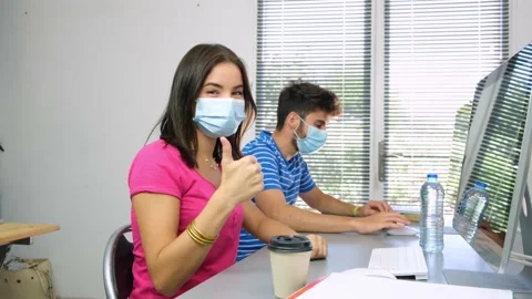 Portrait of beautiful young student in classroom wearing a surgical mask Video stock 139044904
