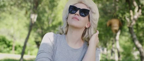 A Portrait Of A Beautiful Young Woman Wearing Hat in nature Stock Footage