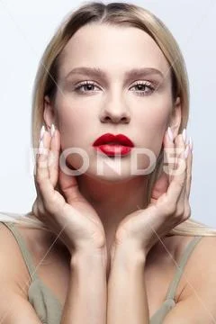 Portrait of beauty young woman on gray studio background Stock Photos